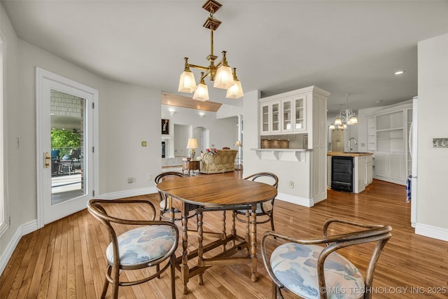 32290 S 630th Rd, Jay, OK 74346 - dining room with hardwood / wood-style floors, baseboards, recessed lighting, beverage cooler, and a chandelier