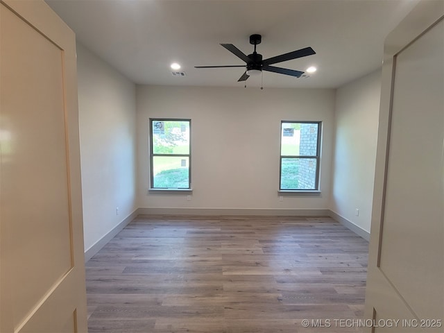 14474 N 50th W Ave, Skiatook, OK 74070 - unfurnished room with healthy amount of natural light, recessed lighting, wood finished floors, ceiling fan, and baseboards
