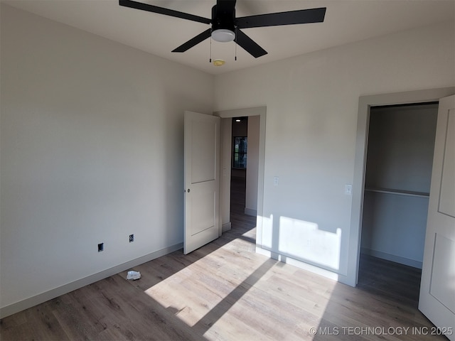 14474 N 50th W Ave, Skiatook, OK 74070 - unfurnished bedroom featuring light wood-style floors, baseboards, and ceiling fan