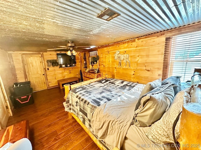 809 N K St, Quinton, OK 74561 - bedroom with wood walls and wood-type flooring