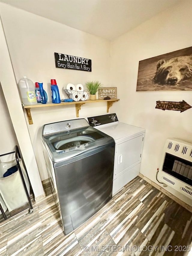 809 N K St, Quinton, OK 74561 - washroom featuring heating unit, washer and dryer, and wood finished floors