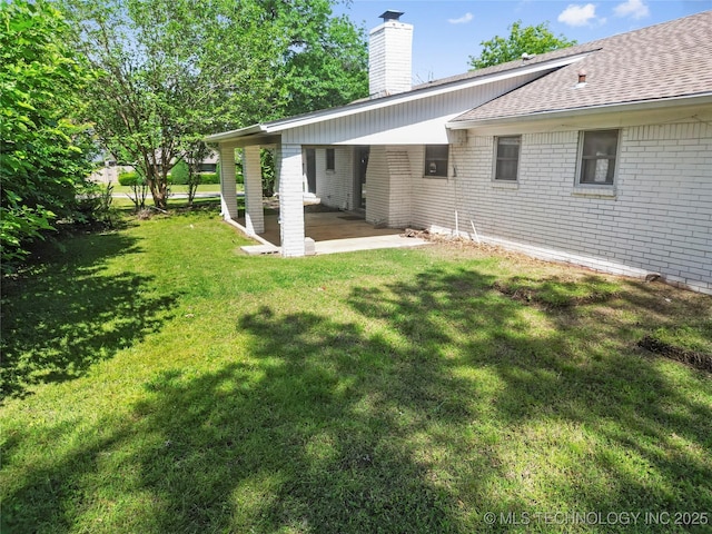 5854 E 46th Pl, Tulsa, OK 74135 - view of grassy yard with a patio area