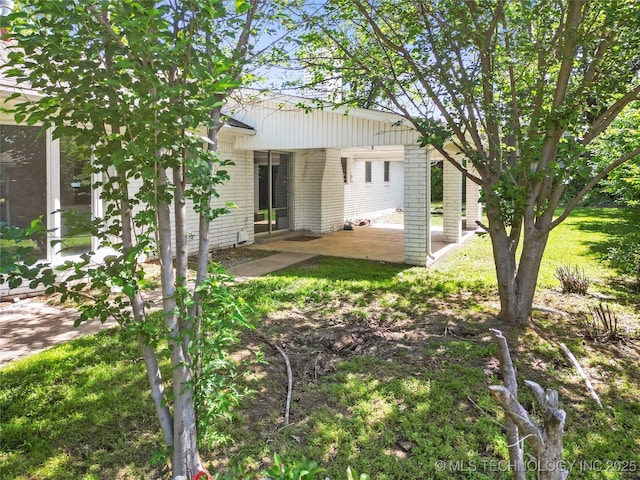 5854 E 46th Pl, Tulsa, OK 74135 - rear view of house featuring brick siding and a patio area