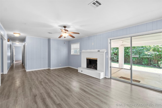 5854 E 46th Pl, Tulsa, OK 74135 - unfurnished living room with crown molding, wood finished floors, ceiling fan, a brick fireplace, and baseboards