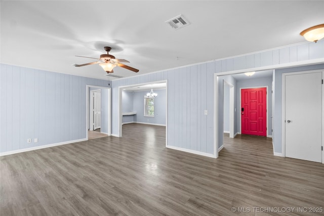 5854 E 46th Pl, Tulsa, OK 74135 - unfurnished living room featuring ceiling fan, a chandelier, wood finished floors, baseboards, and ornamental molding