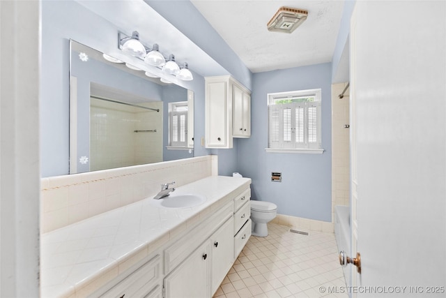5854 E 46th Pl, Tulsa, OK 74135 - full bathroom with toilet, tile patterned floors, vanity, and baseboards