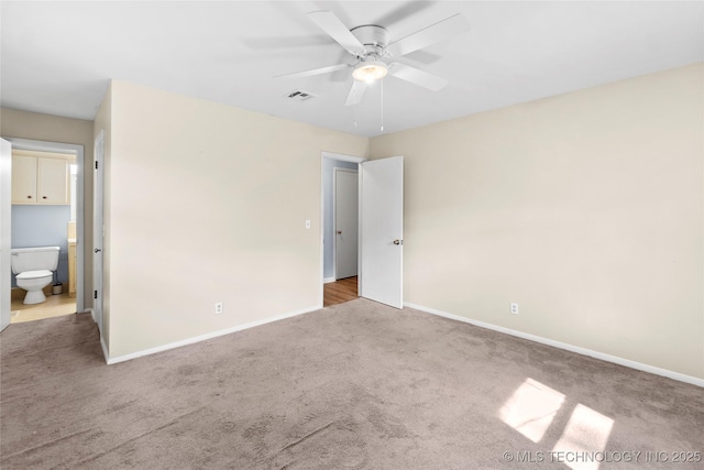 5854 E 46th Pl, Tulsa, OK 74135 - unfurnished bedroom with carpet flooring, baseboards, connected bathroom, and a ceiling fan
