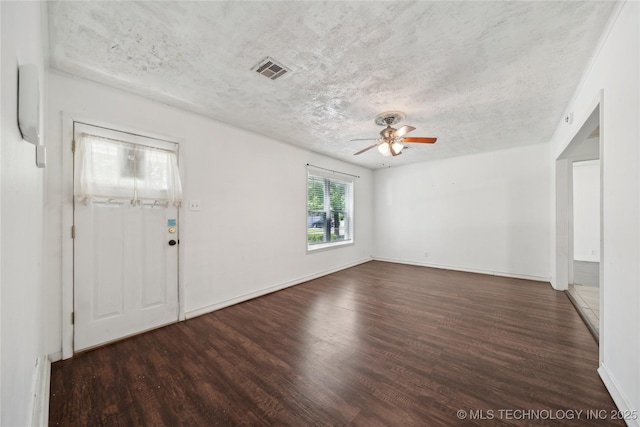 entrance foyer featuring wood finished floors, ceiling fan, a textured ceiling, and baseboards