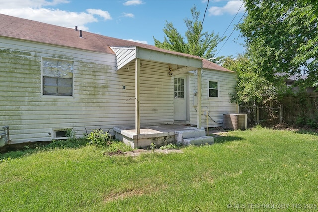 back of house featuring central AC unit