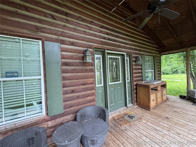 1509 Pawnee Ave, Hartshorne, OK 74547 - wooden terrace featuring a ceiling fan
