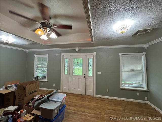 1509 Pawnee Ave, Hartshorne, OK 74547 - entryway with a textured ceiling, wood finished floors, a ceiling fan, crown molding, and baseboards