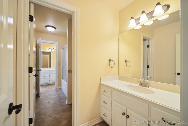 7287 E 111th Pl, Bixby, OK 74008 - bathroom featuring vanity, tile patterned flooring, and baseboards