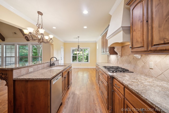 7287 E 111th Pl, Bixby, OK 74008 - kitchen with a sink, stainless steel appliances, light wood-type flooring, tasteful backsplash, and custom exhaust hood
