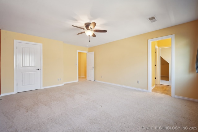 7287 E 111th Pl, Bixby, OK 74008 - unfurnished bedroom featuring light colored carpet, baseboards, and a ceiling fan