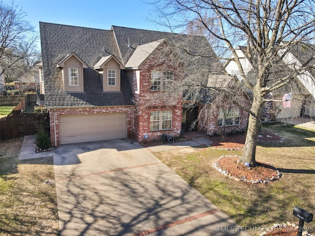 5446 E 88th St, Tulsa, OK 74137 - traditional-style house featuring brick siding, concrete driveway, roof with shingles, and a garage