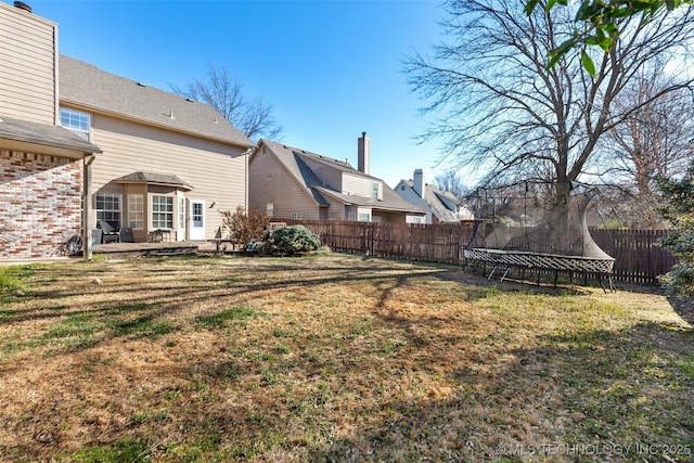 5446 E 88th St, Tulsa, OK 74137 - view of yard featuring a trampoline and a patio area