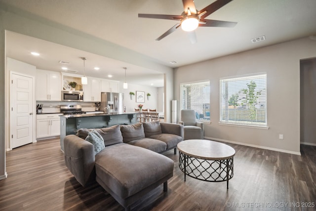 3854 E 144th St S, Bixby, OK 74008 - living area with dark wood finished floors, recessed lighting, baseboards, and a ceiling fan