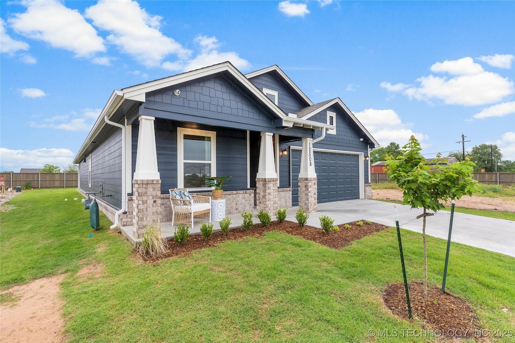 12508 N 134th E Ave, Owasso, OK 74021 - craftsman house featuring a porch, driveway, and an attached garage