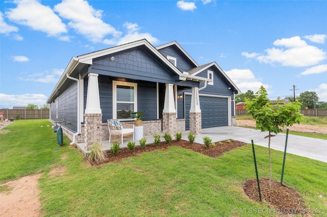 12508 N 134th E Ave, Owasso, OK 74021 - craftsman house featuring a porch, driveway, and an attached garage