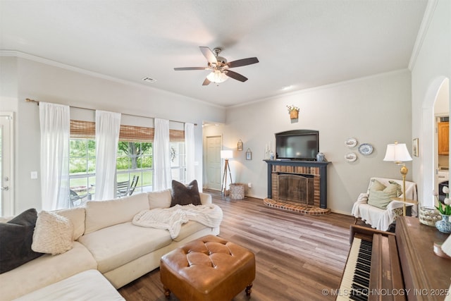 29901 E 137th Pl, Coweta, OK 74429 - living area featuring a fireplace, a ceiling fan, wood finished floors, ornamental molding, and baseboards