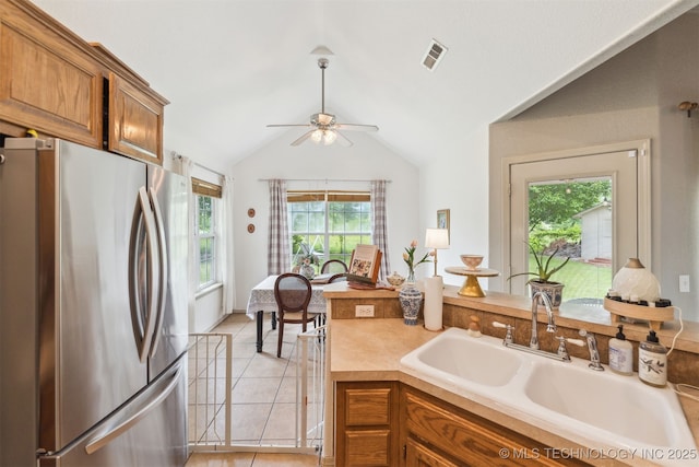 29901 E 137th Pl, Coweta, OK 74429 - kitchen featuring freestanding refrigerator, a sink, brown cabinets, a ceiling fan, and light countertops