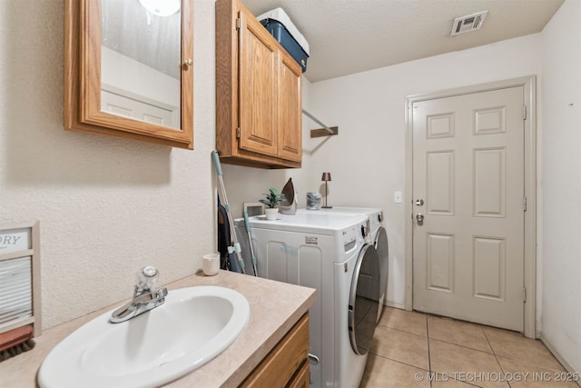 29901 E 137th Pl, Coweta, OK 74429 - laundry area with independent washer and dryer, a sink, and light tile patterned floors