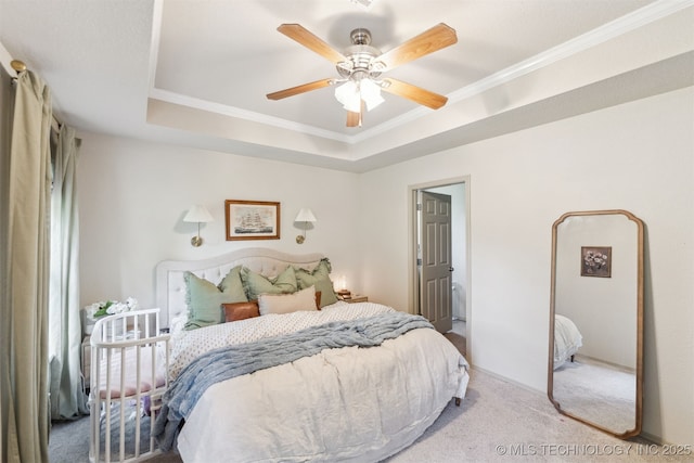 29901 E 137th Pl, Coweta, OK 74429 - bedroom with carpet flooring, a tray ceiling, ornamental molding, and ceiling fan