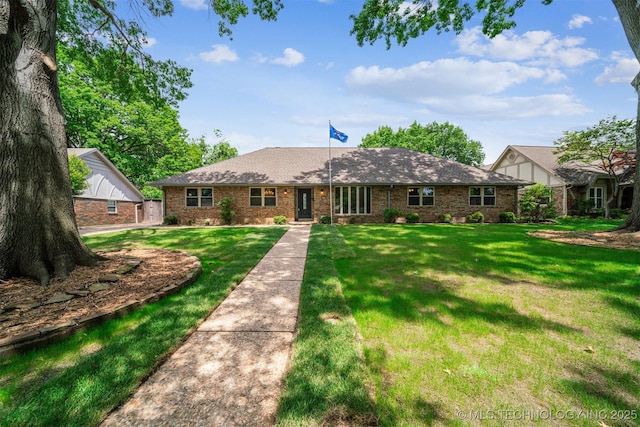 6123 E 53rd St, Tulsa, OK 74135 - view of front of home featuring brick siding and a front yard
