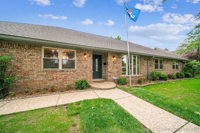 6123 E 53rd St, Tulsa, OK 74135 - ranch-style house with a front yard, brick siding, and roof with shingles