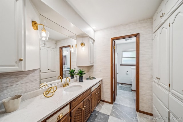 6123 E 53rd St, Tulsa, OK 74135 - bathroom featuring vanity and tasteful backsplash