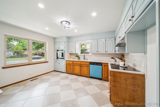 6123 E 53rd St, Tulsa, OK 74135 - kitchen with dishwasher, stainless steel oven, light countertops, backsplash, and cooktop