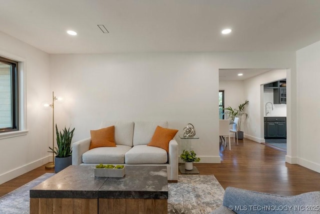 4907 S Boston Ave, Tulsa, OK 74105 - living area featuring wood finished floors, baseboards, and recessed lighting