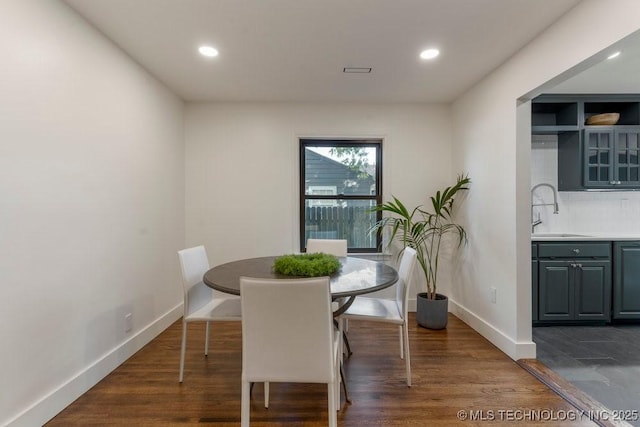 4907 S Boston Ave, Tulsa, OK 74105 - dining room with recessed lighting, baseboards, and dark wood-style floors