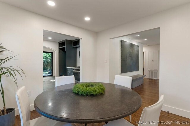 4907 S Boston Ave, Tulsa, OK 74105 - dining area with baseboards, wood finished floors, and recessed lighting