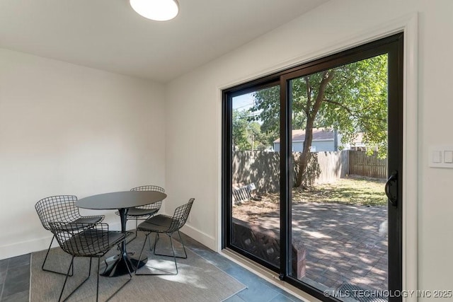 4907 S Boston Ave, Tulsa, OK 74105 - dining area featuring healthy amount of natural light and baseboards