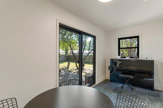 4907 S Boston Ave, Tulsa, OK 74105 - sitting room with plenty of natural light, baseboards, and stone finish floors