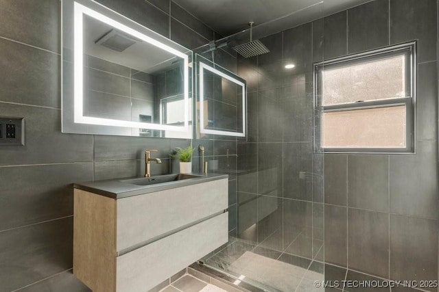 4907 S Boston Ave, Tulsa, OK 74105 - bathroom featuring a walk in shower, vanity, and tile walls