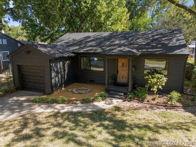4907 S Boston Ave, Tulsa, OK 74105 - view of front of property featuring a garage, a shingled roof, concrete driveway, and a front lawn