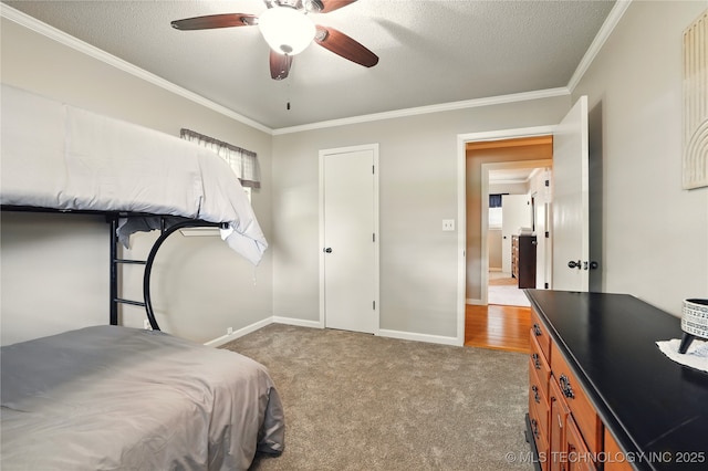 300 Michele, Calera, OK 74730 - bedroom featuring crown molding, carpet floors, baseboards, a textured ceiling, and a ceiling fan
