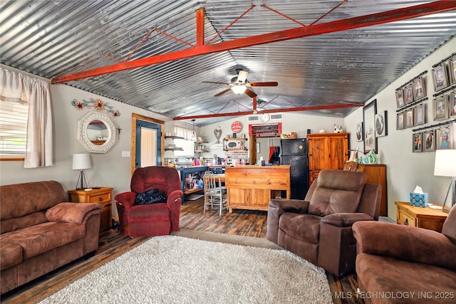 300 Michele, Calera, OK 74730 - living area with wood finished floors, vaulted ceiling, and a ceiling fan