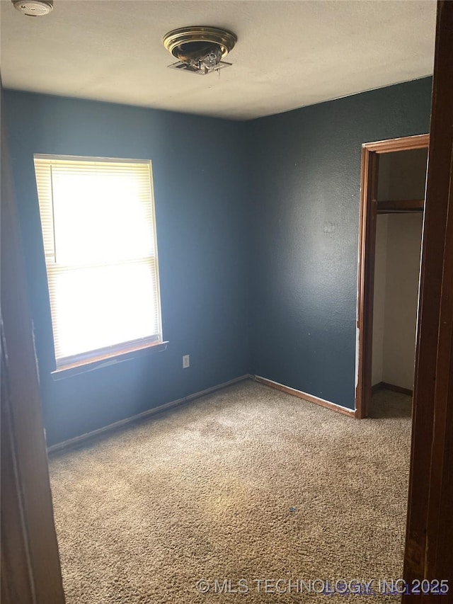 10813 E 34th Pl, Tulsa, OK 74146 - unfurnished bedroom with carpet floors and baseboards