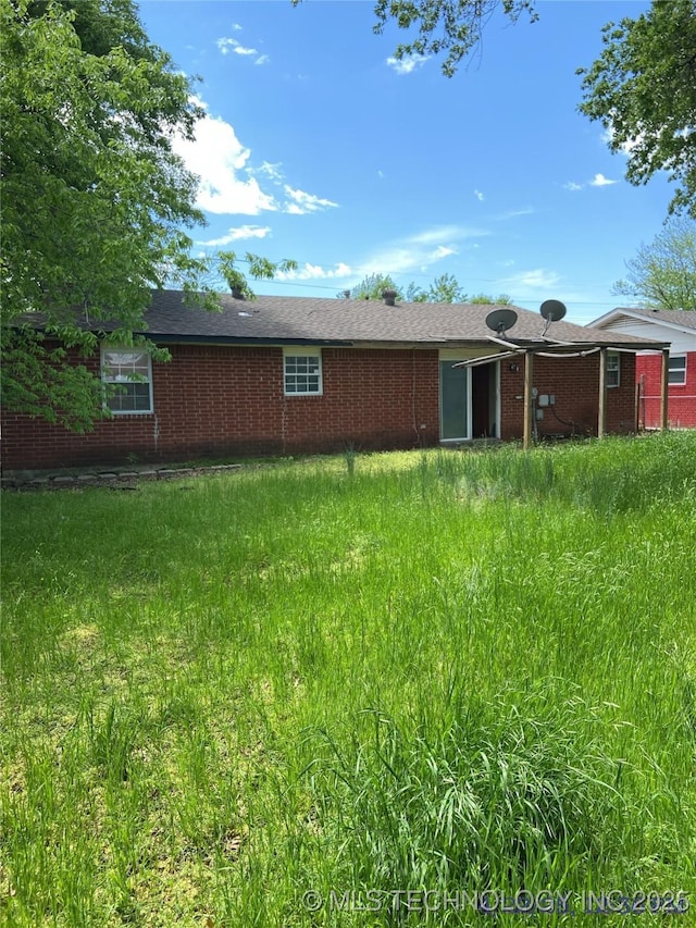 10813 E 34th Pl, Tulsa, OK 74146 - rear view of property with brick siding