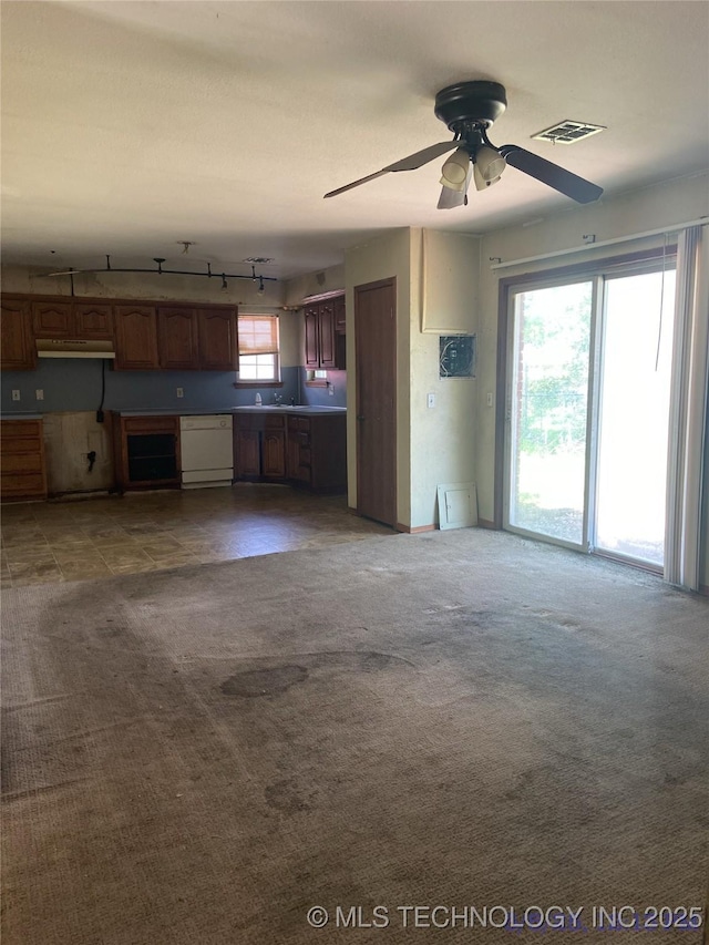 10813 E 34th Pl, Tulsa, OK 74146 - unfurnished living room with carpet, a ceiling fan, and rail lighting