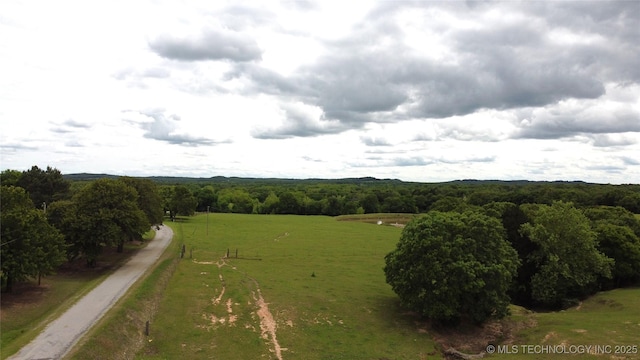 view of rural area featuring a forest