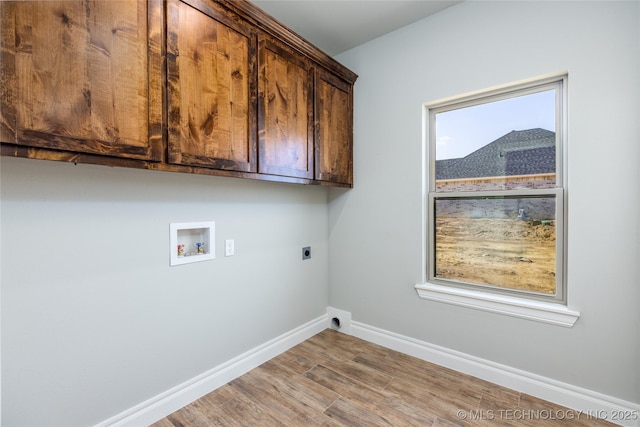 204 Maple Leaf, Durant, OK 74701 - laundry area with electric dryer hookup, cabinet space, hookup for a washing machine, baseboards, and wood finished floors