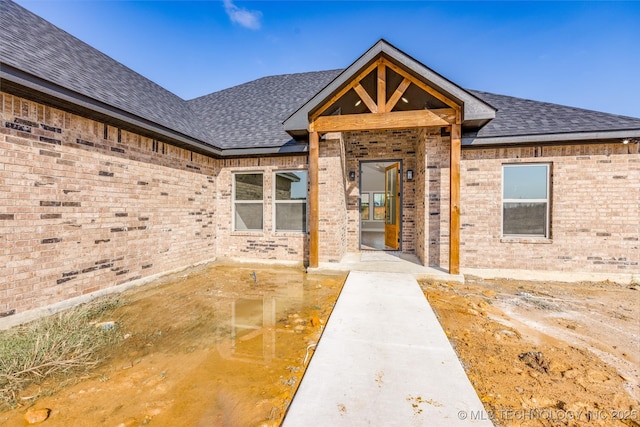 204 Maple Leaf, Durant, OK 74701 - view of front of home with brick siding and a shingled roof