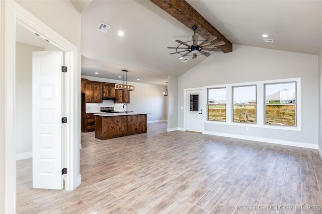 204 Maple Leaf, Durant, OK 74701 - unfurnished living room with beam ceiling, a ceiling fan, a sink, light wood finished floors, and baseboards