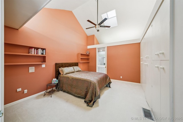 3219 S Birmingham Ave, Tulsa, OK 74105 - carpeted bedroom with a skylight, baseboards, a ceiling fan, connected bathroom, and high vaulted ceiling
