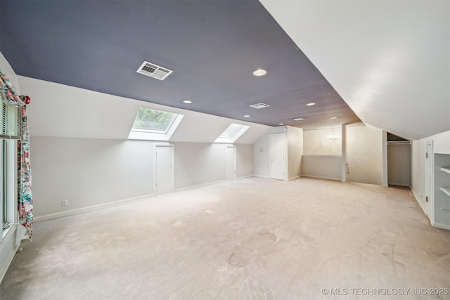 3219 S Birmingham Ave, Tulsa, OK 74105 - additional living space with a skylight, vaulted ceiling, light colored carpet, recessed lighting, and baseboards