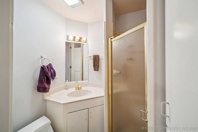 3219 S Birmingham Ave, Tulsa, OK 74105 - full bathroom featuring a stall shower, vanity, and toilet